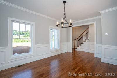 953 High Road Berlin, CT 06037 - Photo 22 of 32 a view of empty room with wooden floor fan and window
