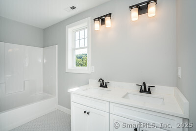 953 High Road Berlin, CT 06037 - Photo 22 of 32 a bathroom with a sink a toilet and a bathtub