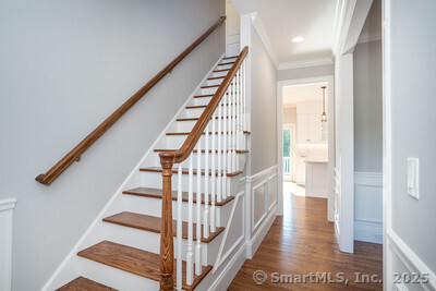 953 High Road Berlin, CT 06037 - Photo 23 of 32 a view of staircase with wooden floor and white walls