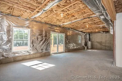 a balcony with wooden floor and fence