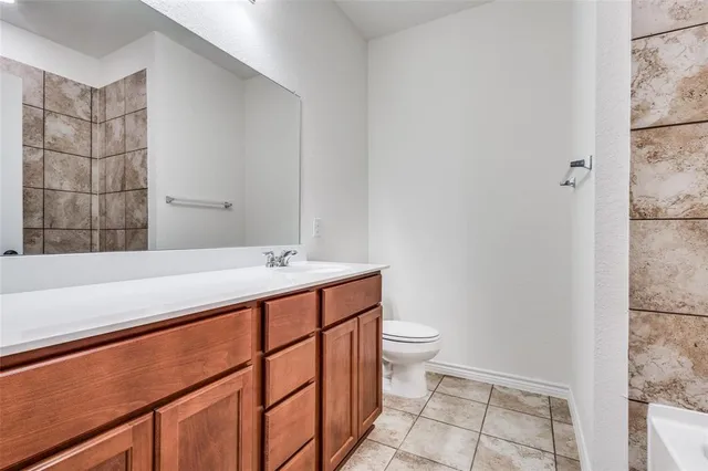 a bathroom with a sink and a toilet