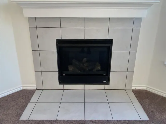 a stove top oven sitting inside of a kitchen