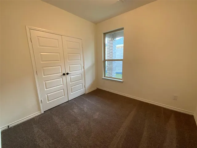 a yard with wooden fence