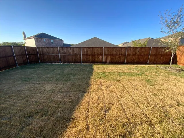 a front view of a house with a large window