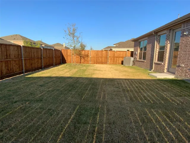 a view of swimming pool with a lounge chair