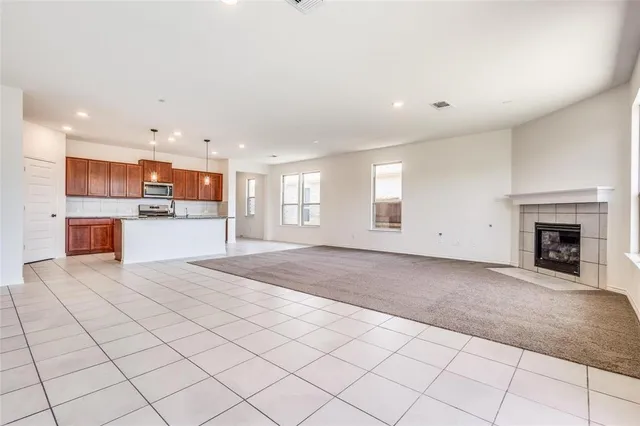 a view of a kitchen with furniture and a fireplace