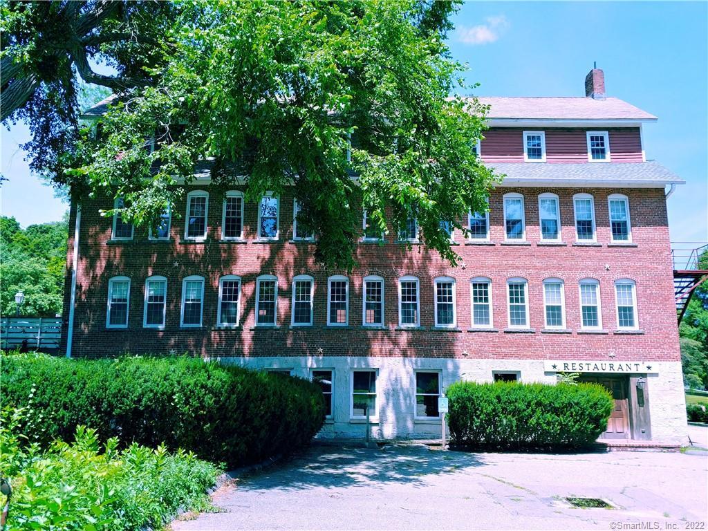 8 Holley Street Salisbury, CT 06039 - Photo 20 of 21 a front view of a house with a yard