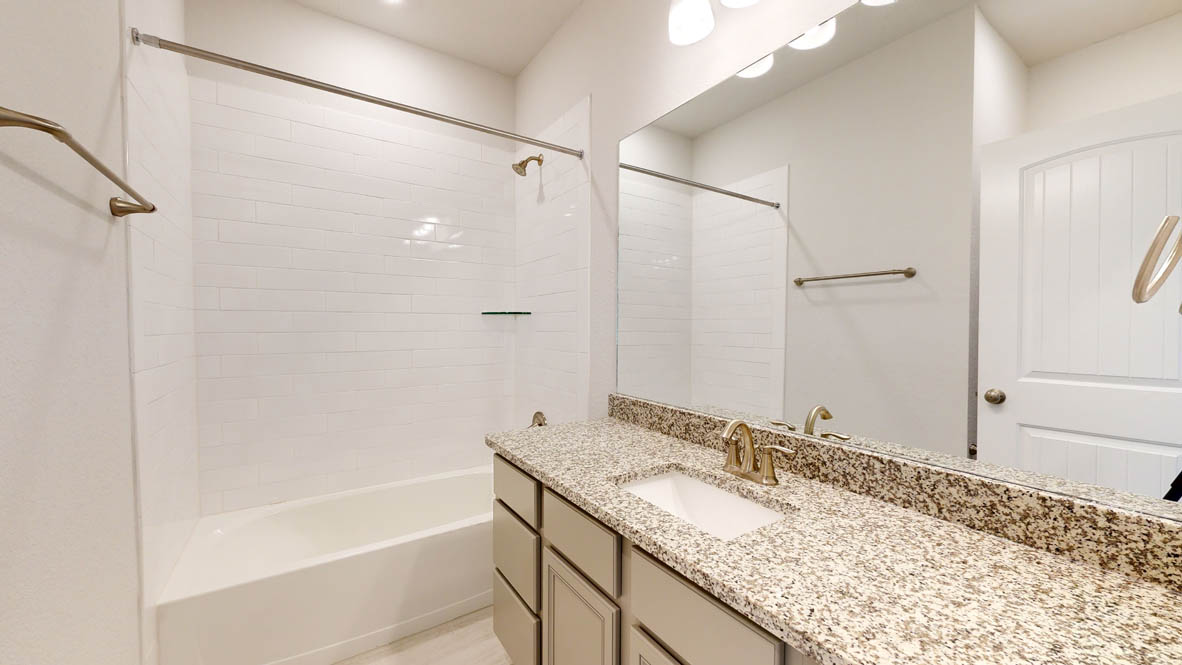 808 Gauge Road Thorndale, TX 76577 - Photo 26 of 31 Granite counters and subway tile create a fresh and inviting bathroom space.