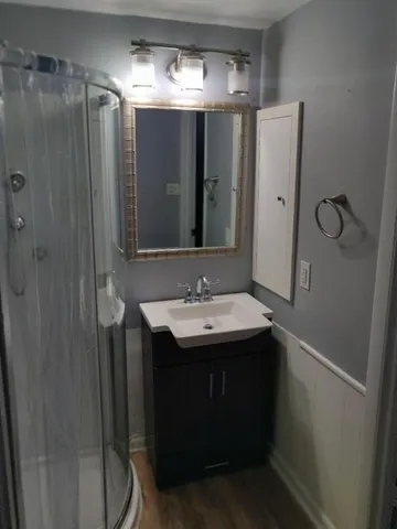 a bathroom with a sink and mirror