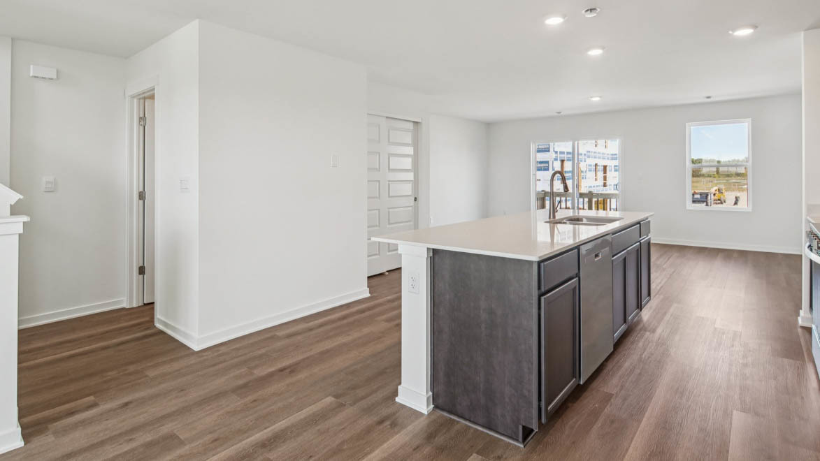6510 Linden Trail, Unit E Wonder Lake, IL 60097 - Photo 5 of 42 a kitchen with stainless steel appliances granite countertop a wooden cabinets a sink and wooden floor