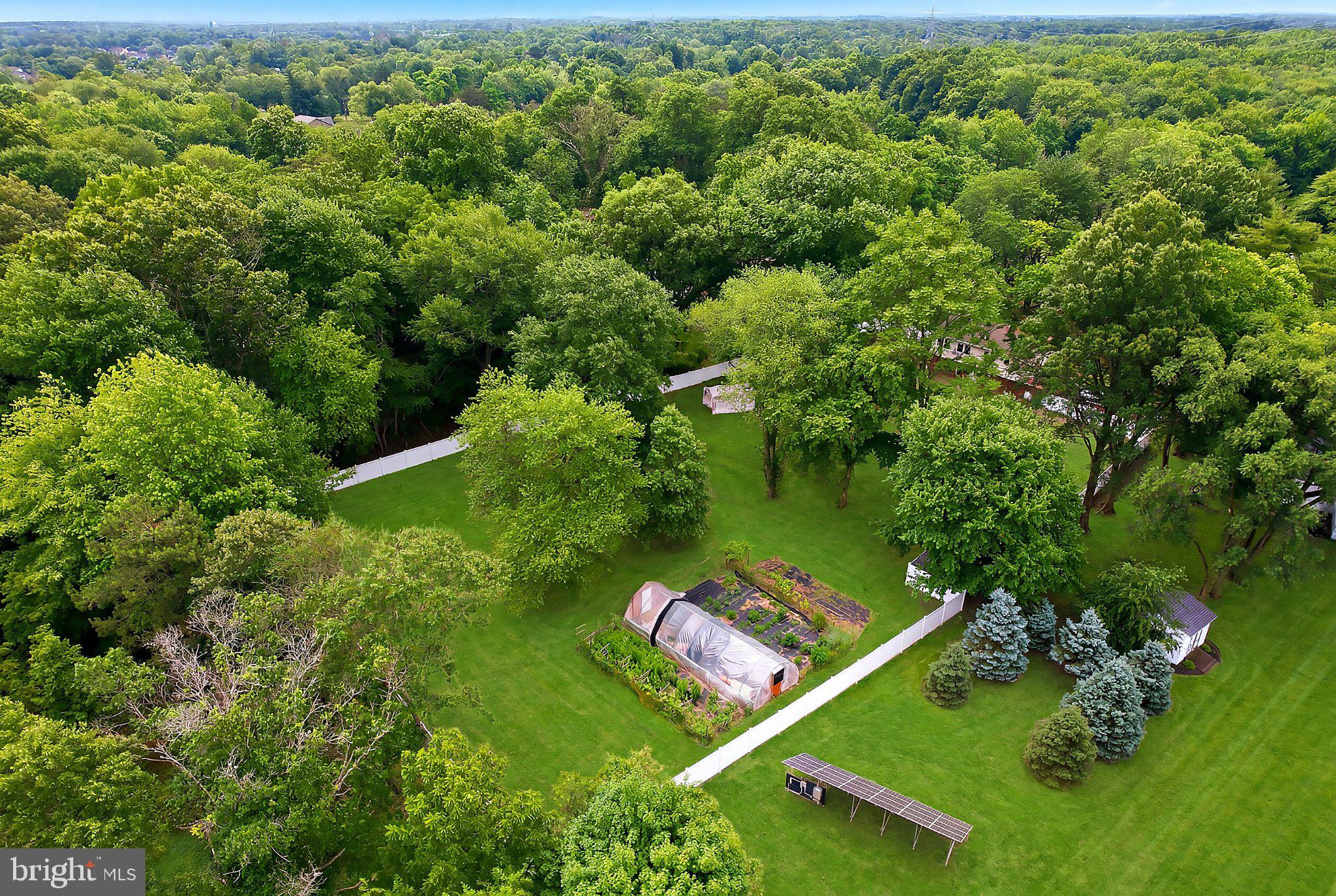 5017 Church Road Mount Laurel, NJ 08054 - Photo 34 of 37 Lush greenery surrounds a serene garden.