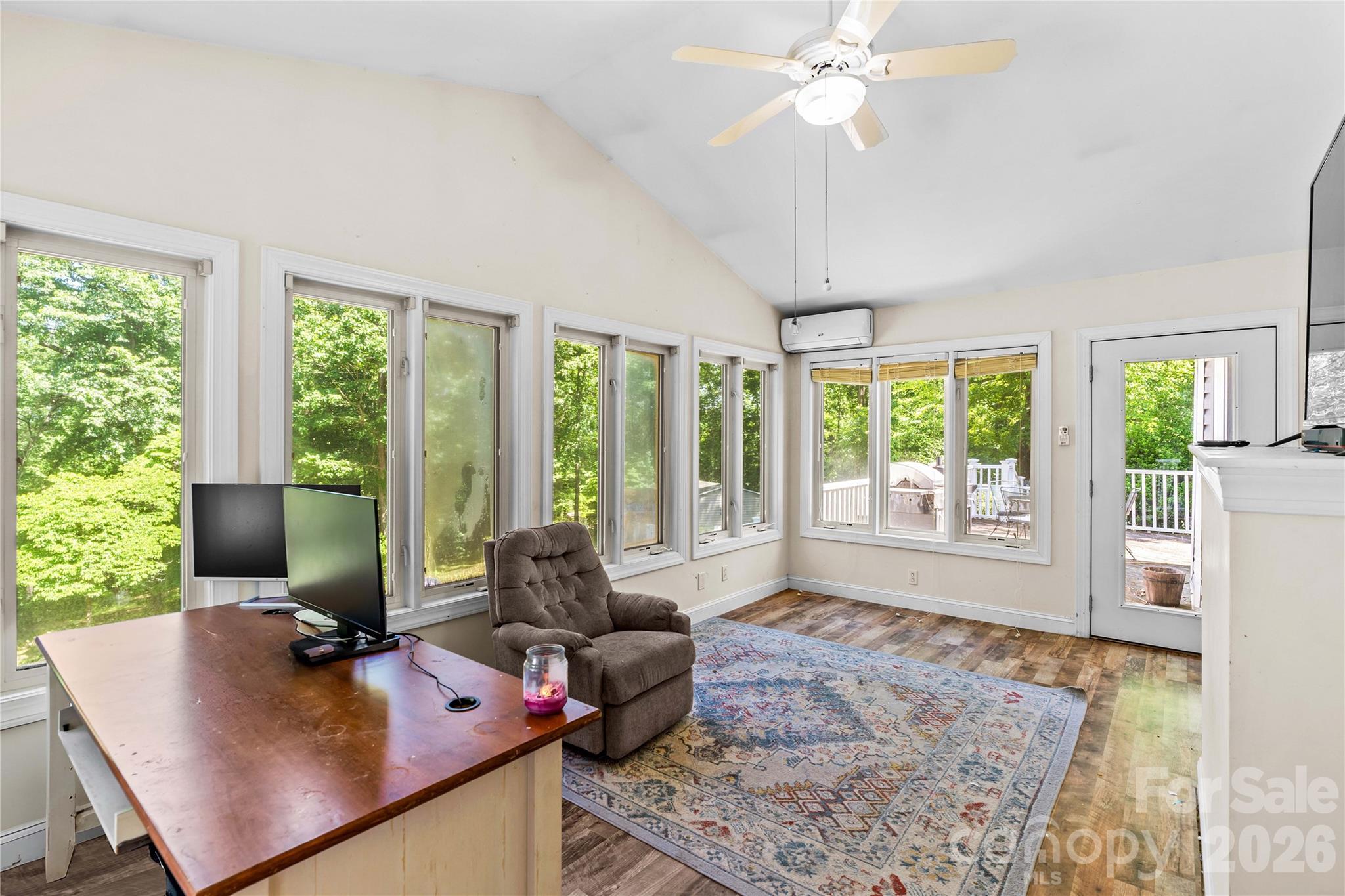 711 Spring Pointe Drive Stony Point, NC 28678 - Photo 11 of 47 a living room with furniture and large windows