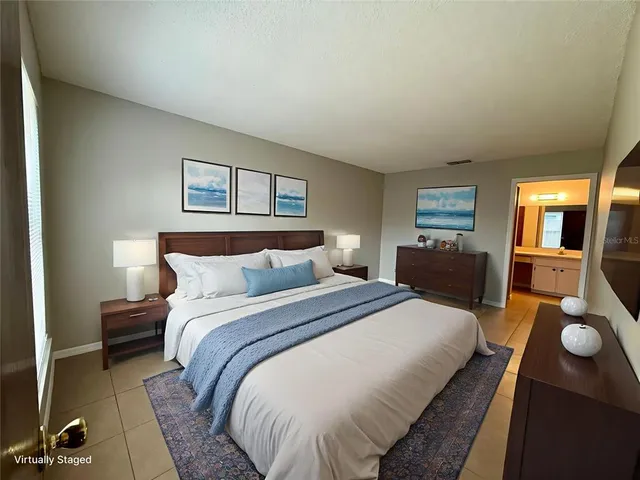 a bed room with a bed and dresser