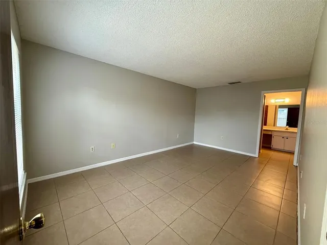 an empty room with a bench