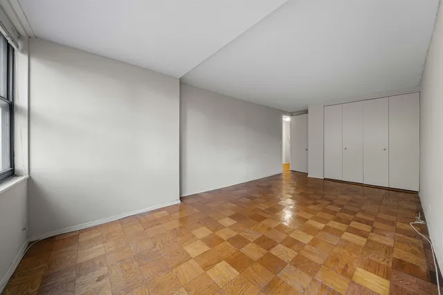 a view of an empty room with a window