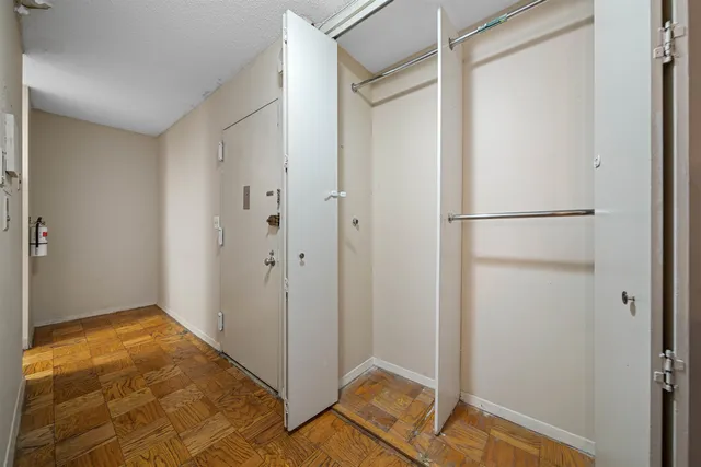 a bathroom with a sink a toilet a mirror and shower