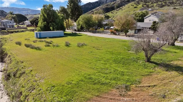 a view of yard with swimming pool