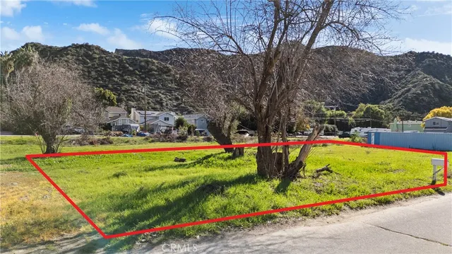 a view of a backyard with swimming pool