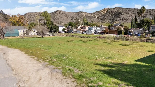 a view of a town with mountains in the background