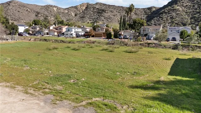 a view of a town with mountains in the background