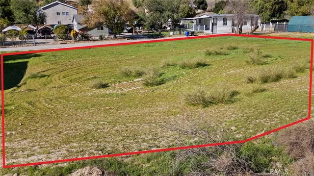a view of yard with swimming pool and seating