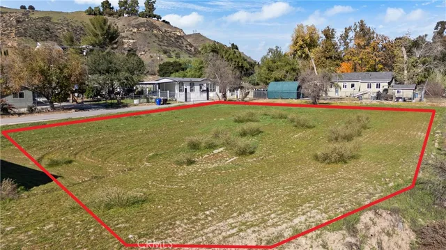a view of swimming pool with outdoor seating and a garden