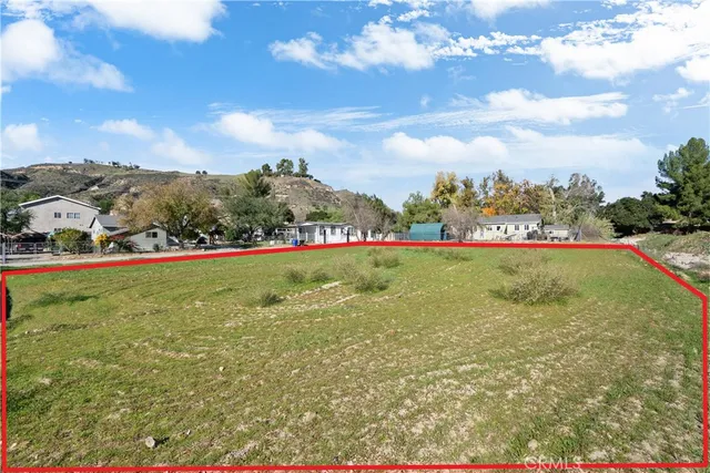 a view of yard with swimming pool and green space