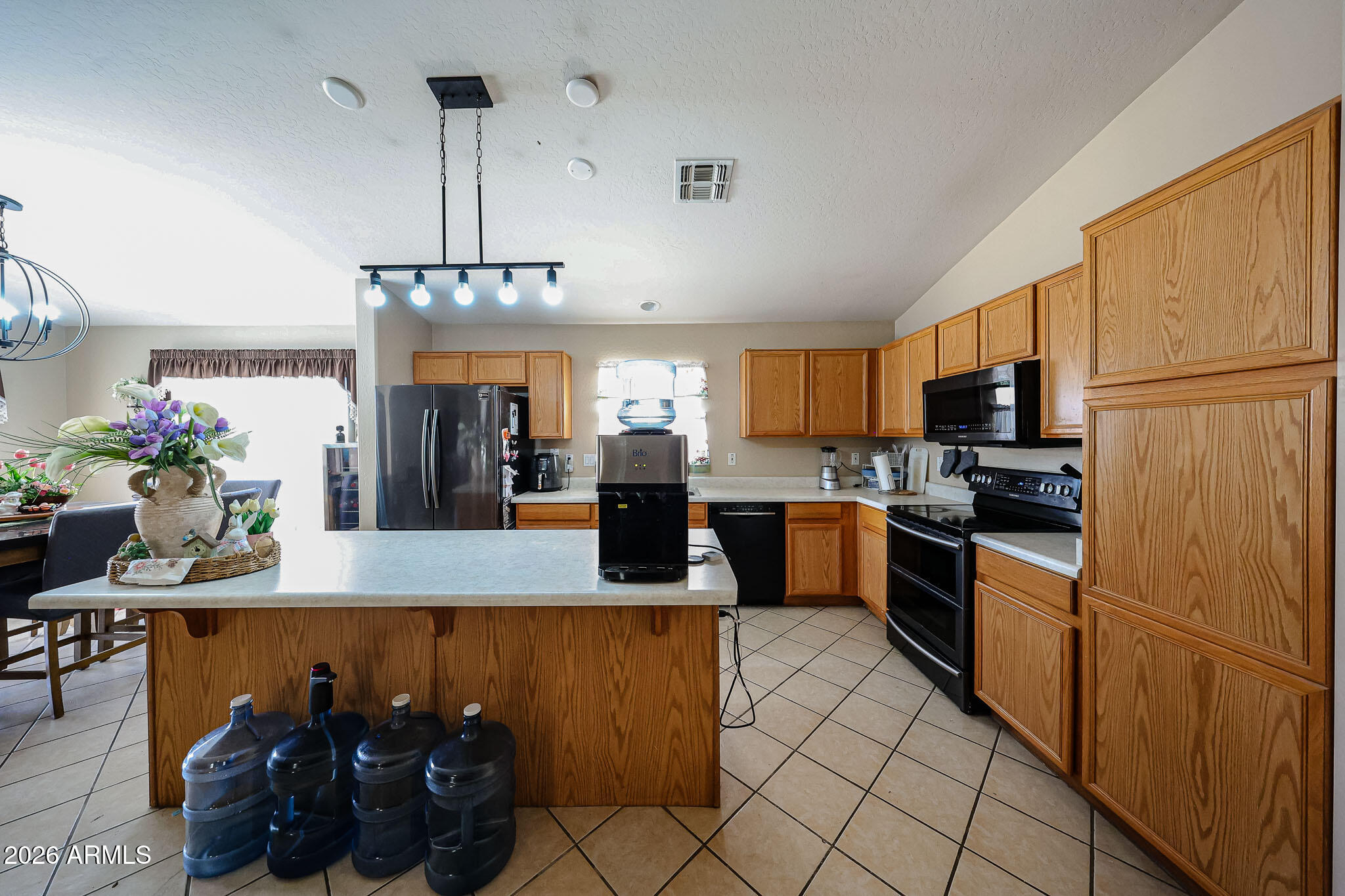 12817 West Sweetwater Avenue El Mirage, AZ 85335 - Photo 18 of 31 Kitchen Island