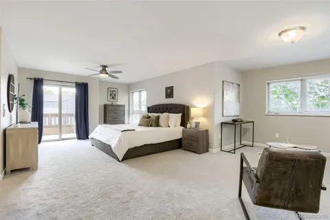 a spacious bedroom with a bed and window