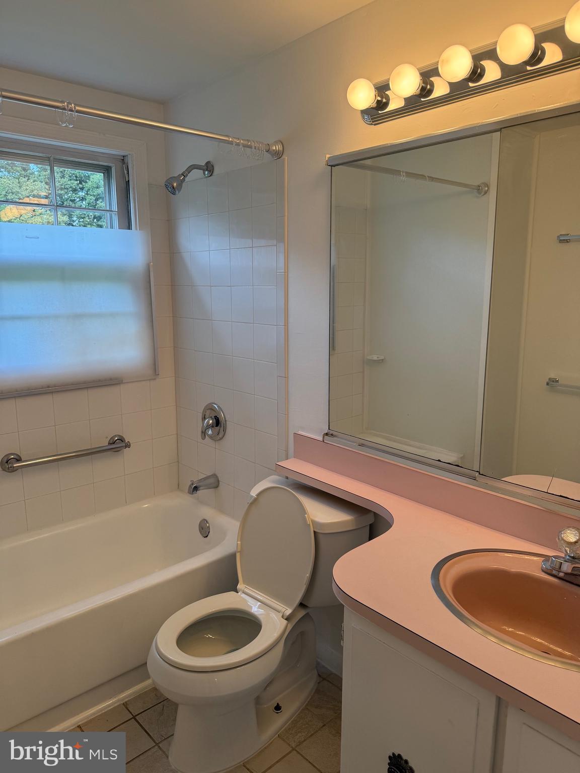 12241 Shadetree Lane Laurel, MD 20708 - Photo 13 of 25 a bathroom with a sink a toilet and shower