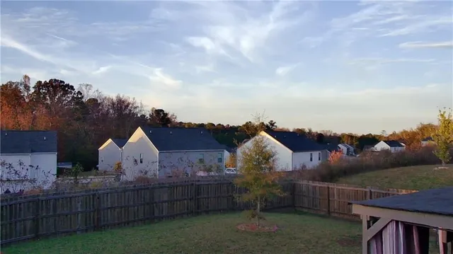 a view of house with yard and entertaining space