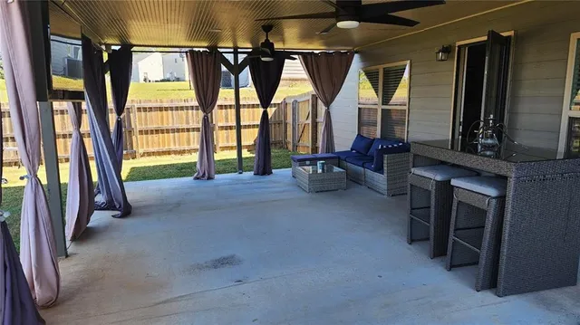 a view of room with furniture and windows