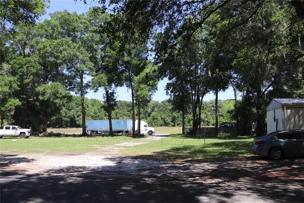 a view of a house with a big yard