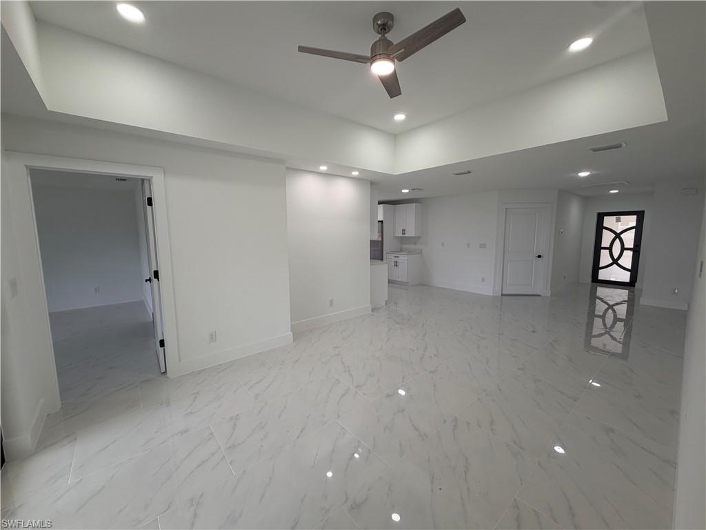 15 Louisiana Road Lehigh Acres, FL 33936 - Photo 16 of 22 an empty room with cabinet and mirrors