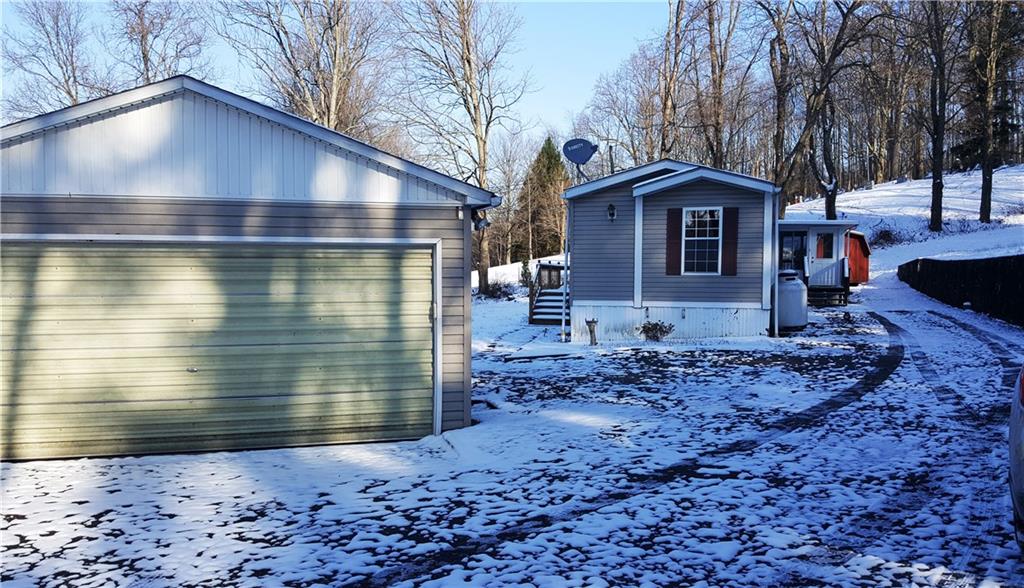 1403 Robb Road Ligonier, PA 15658 - Photo 2 of 18 This home is privately located in a lovely country setting. The 2-car garage has the automatic door and there is a 2-3 bedroom home with sun room and shed.