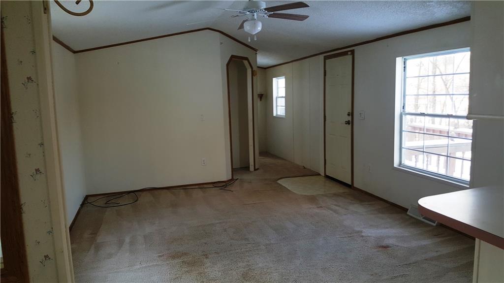 1403 Robb Road Ligonier, PA 15658 - Photo 11 of 18 Living room, front door entry and hallway to 2 bedrooms & bath