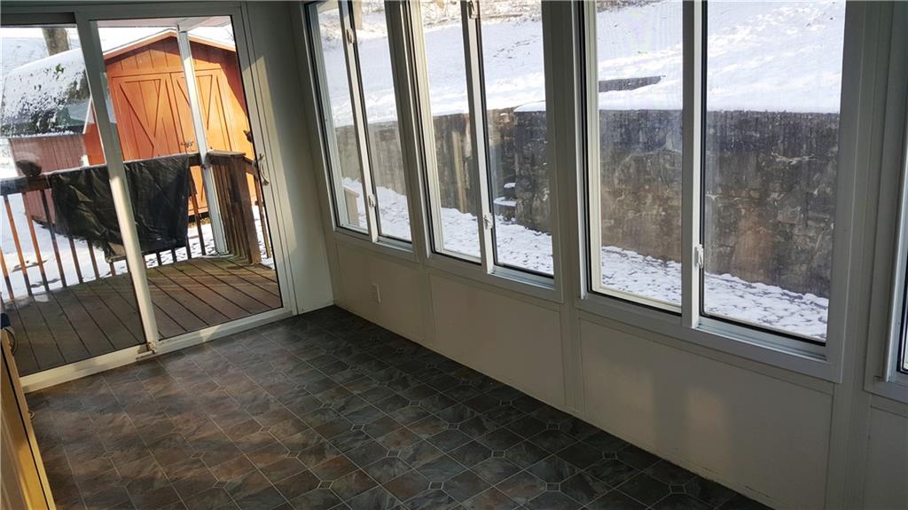 1403 Robb Road Ligonier, PA 15658 - Photo 15 of 18 View of the sun room with sliding door to deck.