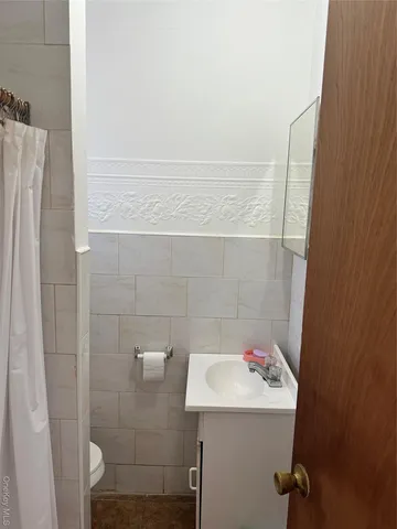 a bathroom with a sink and mirror