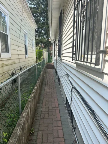 a view of a balcony with wooden floor