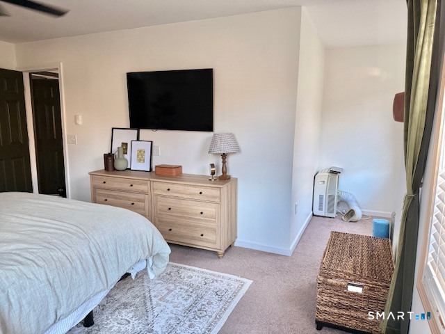 104 Ginger Lane Torrington, CT 06790 - Photo 19 of 33 a bedroom with a bed and a flat screen tv