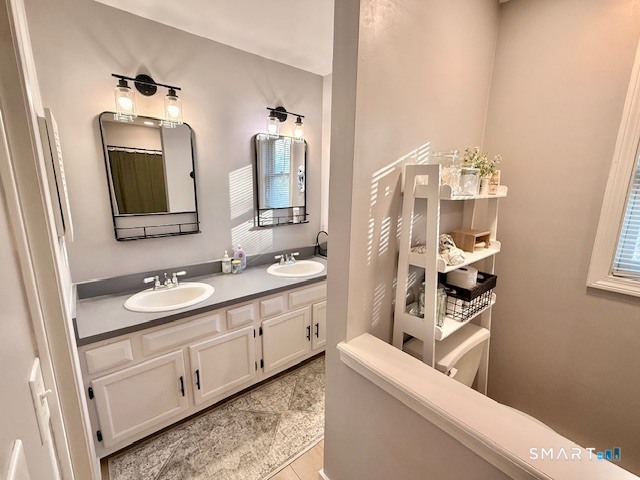 104 Ginger Lane Torrington, CT 06790 - Photo 21 of 33 a bathroom with a sink a vanity and a mirror