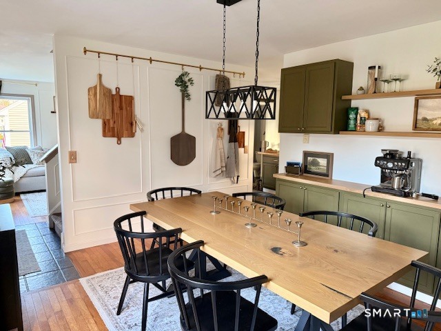 104 Ginger Lane Torrington, CT 06790 - Photo 7 of 33 a dining table with chairs and wooden floor