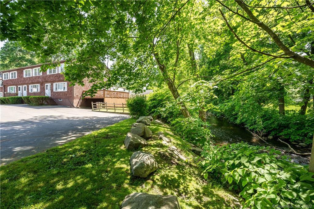 38 Windsor Road, Unit 38C Stamford, CT 06905 - Photo 1 of 1 a view of a house with a tree