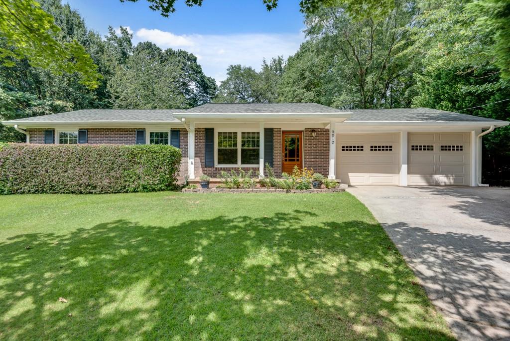 3012 Delcourt Drive Decatur, GA 30033 - Photo 1 of 1 a front view of house with yard and green space