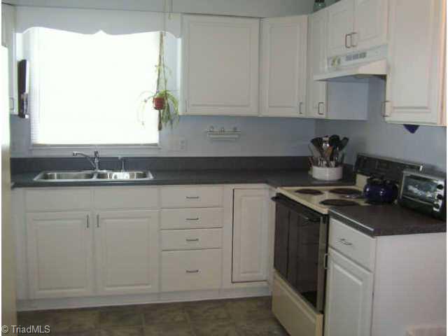 4841 Tower Road, Unit A Greensboro, NC 27410 - Photo 3 of 6 Other. Bright and Open Kitchen With All Major Appliances Included.