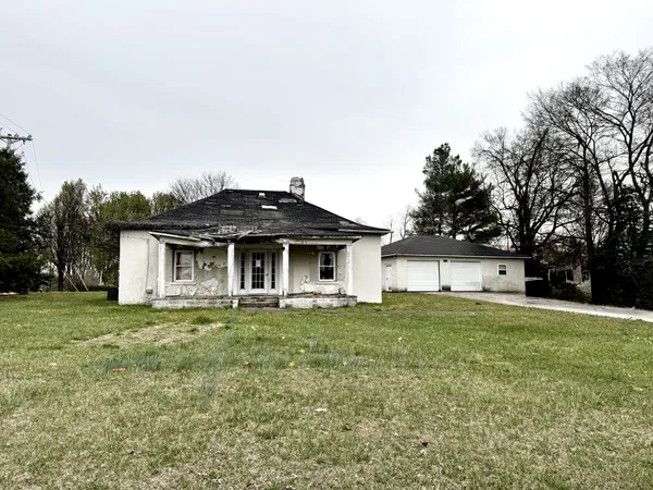 a house with trees in front of it