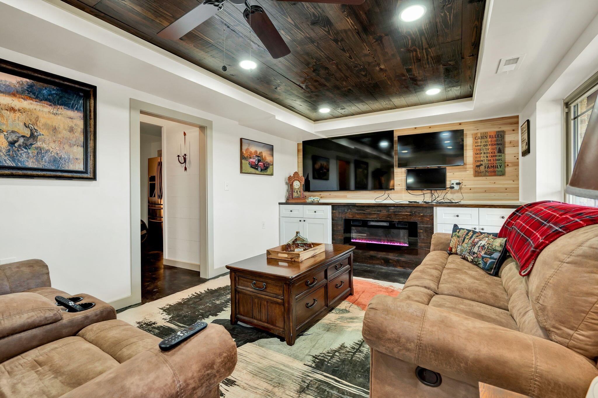 483 Minnis Road Cleveland, TN 37323 - Photo 37 of 49 a living room with furniture a fireplace and a flat screen tv