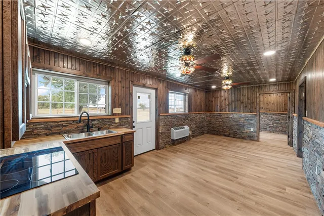 a view of a living room and kitchen with furniture