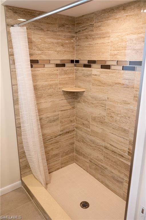 5654 Eichen Circle Fort Myers, FL 33919 - Photo 12 of 47 Bathroom with a shower stall and tile patterned floors