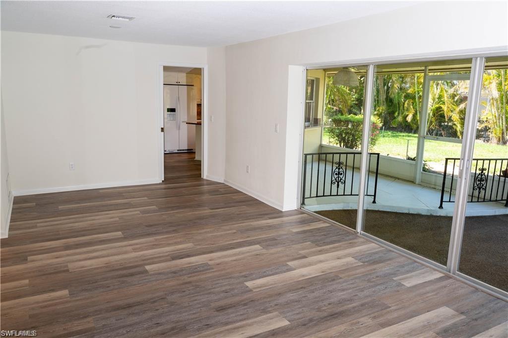 5654 Eichen Circle Fort Myers, FL 33919 - Photo 21 of 47 Spare room with wood finished floors and baseboards